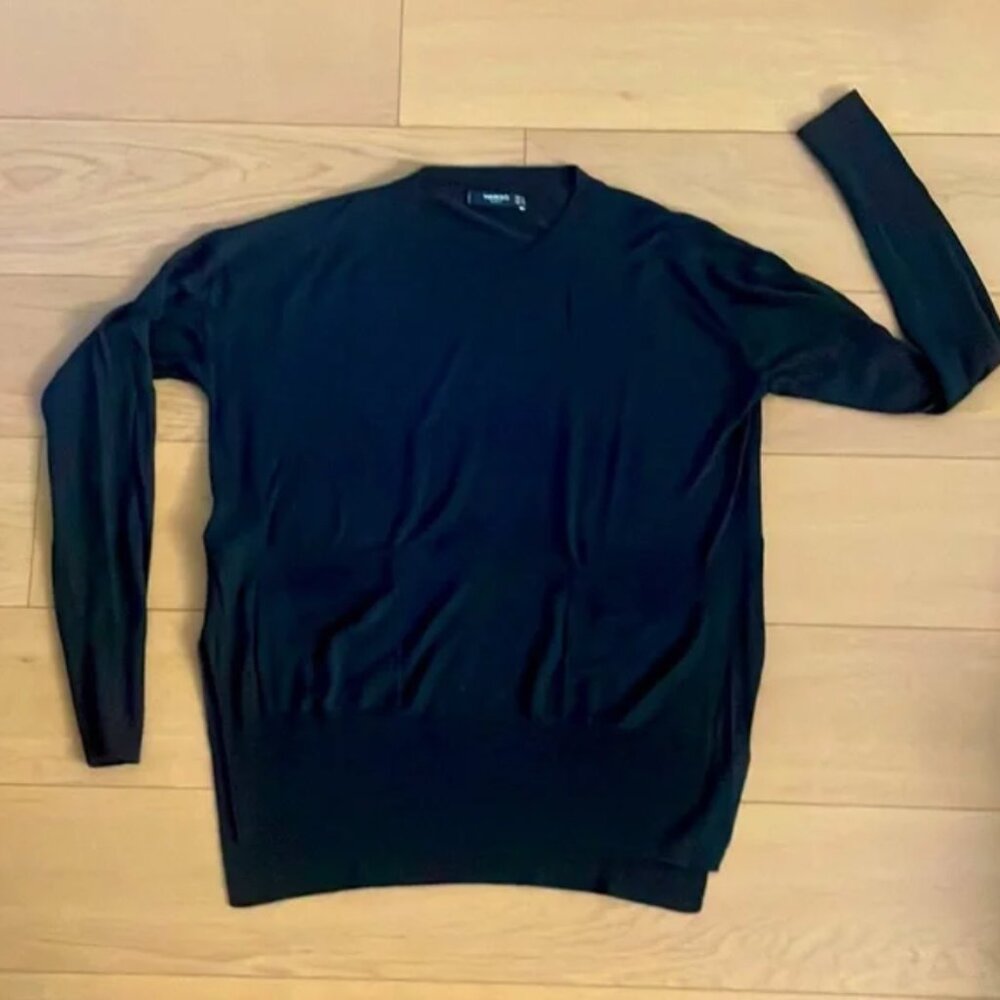 Boxy cropped sweater from Mango with pockets.